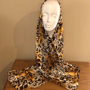 Oblong scarf in animal print in shades of brown, gold and cream